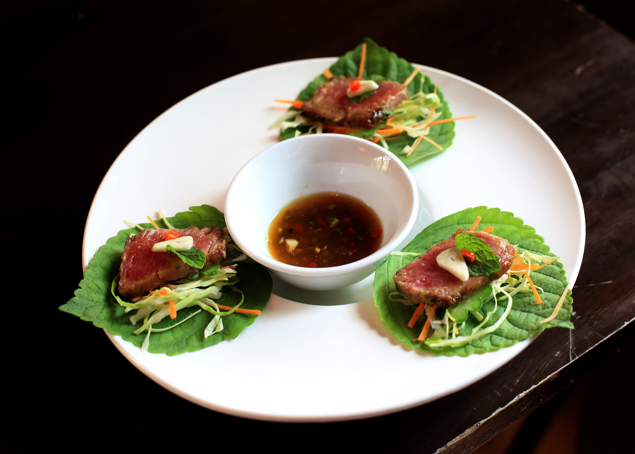 Thai shimi at Guerrera, seared local tuna served on a fresh sesame leaf with thai chili and hot dipping sauce